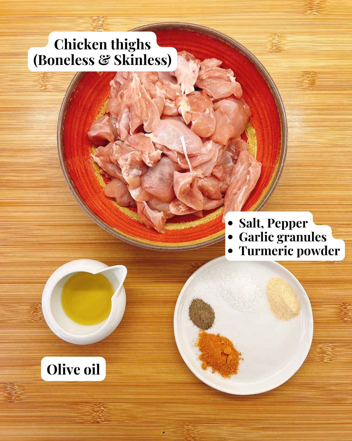 Photo shows ingredients and seasoning for making air fried chicken skewers.