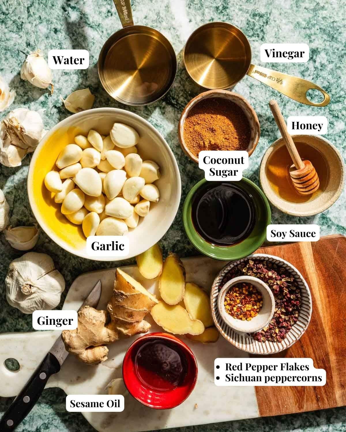 Image shows ingredients used to make marinated garlic pickles.