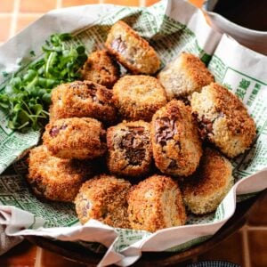 Recipe image shows crispy eggplants paired with sweet & sour sauce on the side.