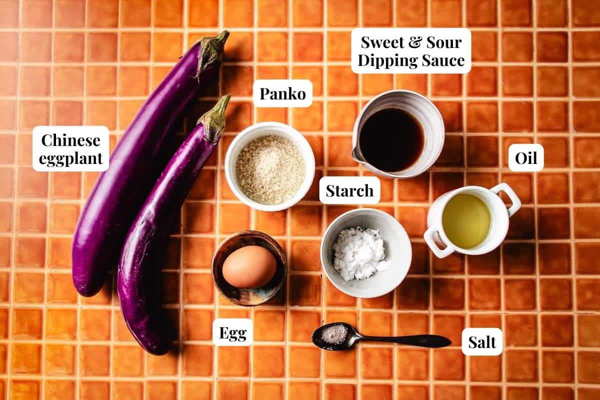 Photo shows Chinese eggplants, breading ingredients, and sweet sour dip sauce to make the dish.