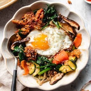 Recipe image for crispy rice bibimbap salad with fresh vegetables, bibimbap sauce, and crisp rice grains.