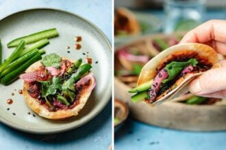 Two images: on the left, a plate with sliced green cucumbers and a mini Smashed Dumpling Tacos topped with vegetables and herbs. On the right, a hand holds a folded crispy dumpling tacos with similar veggie toppings and black sesame seeds.