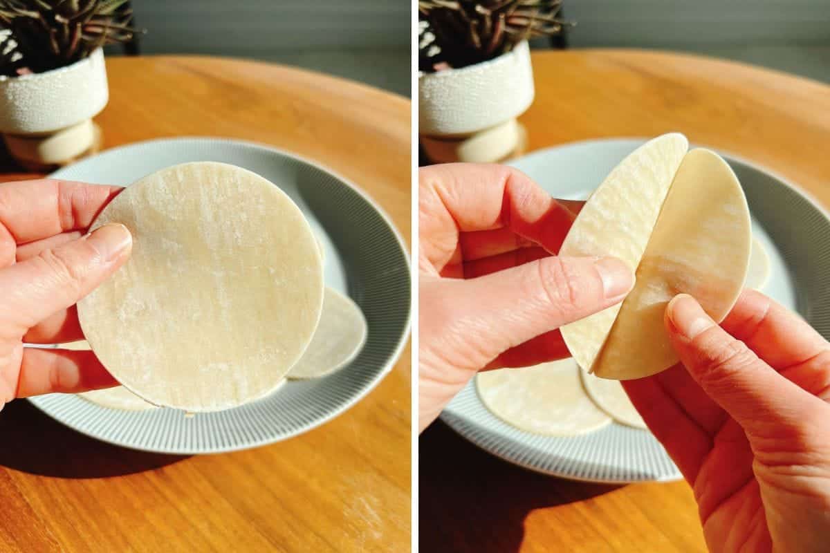 A person holds a round dumpling wrapper in one hand, then shows two layers and stacked wrappers with both hands over a plate on a wooden table. Sunlight brightens the scene, hinting at Smashed Dumpling Tacos being prepared.