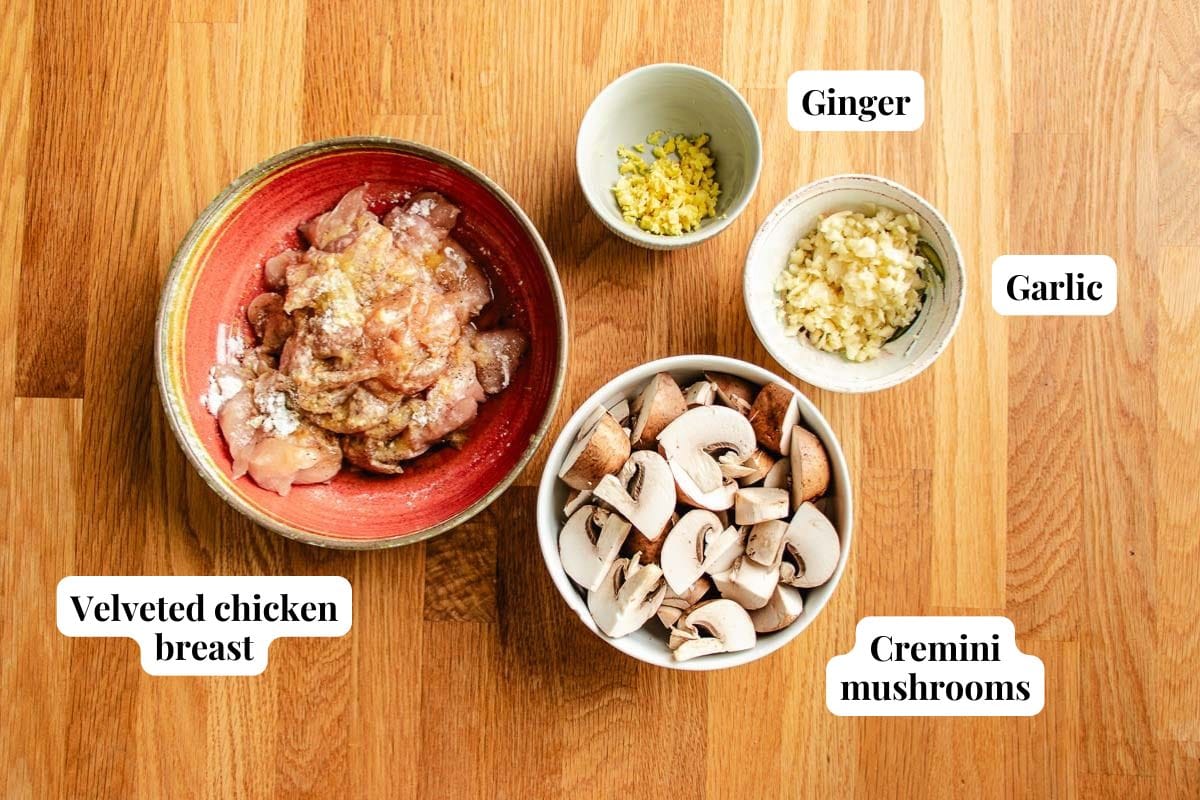 Chicken seasoning with Chinese style velveted chicken breasts, minced garlic and ginger, and quartered mushrooms.