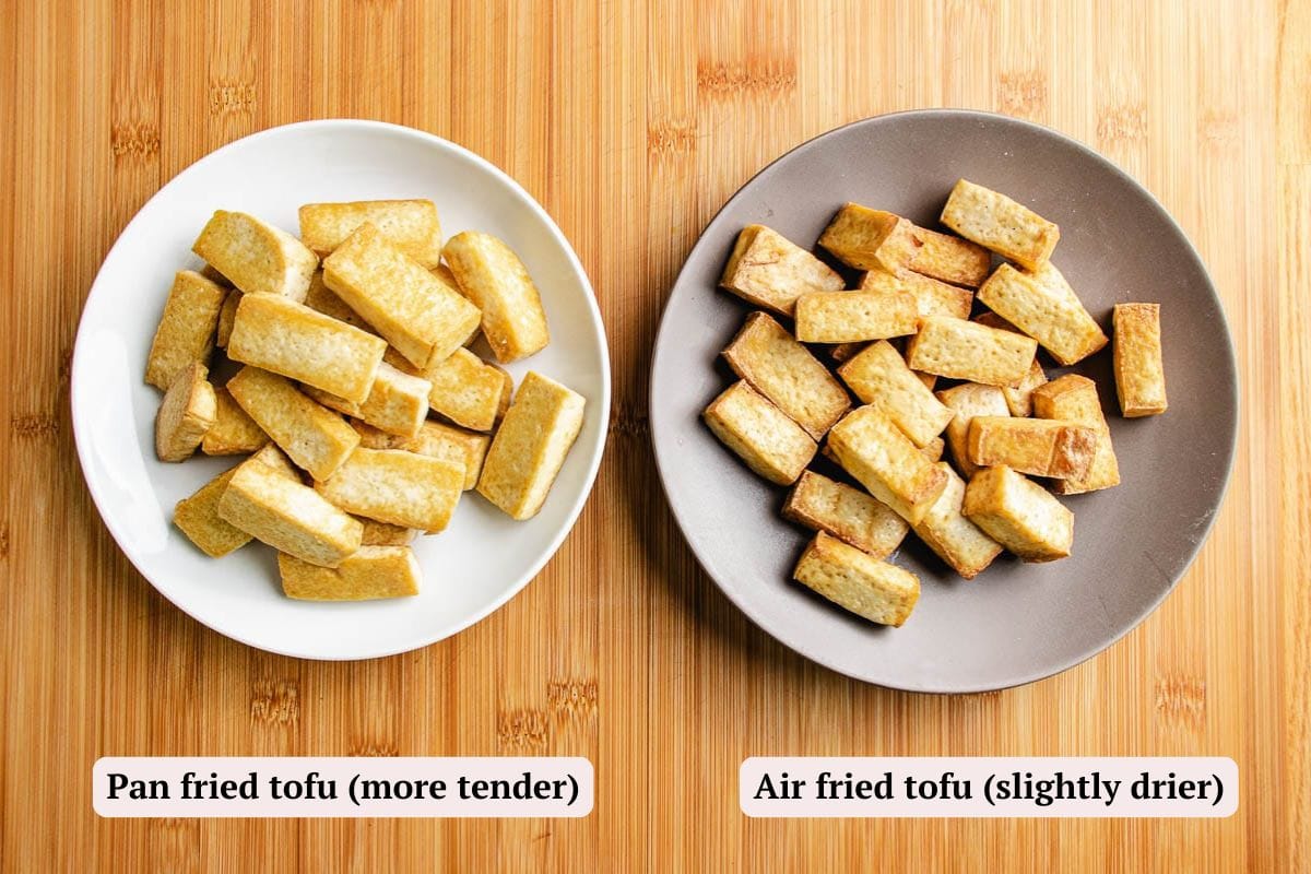 Two plates of tofu on a wood surface: the left plate features pan-fried tofu, labeled more tender, while the right has air-fried tofu, labeled slightly drier. Both styles would pair perfectly with a savory topping like tofu with minced pork.
