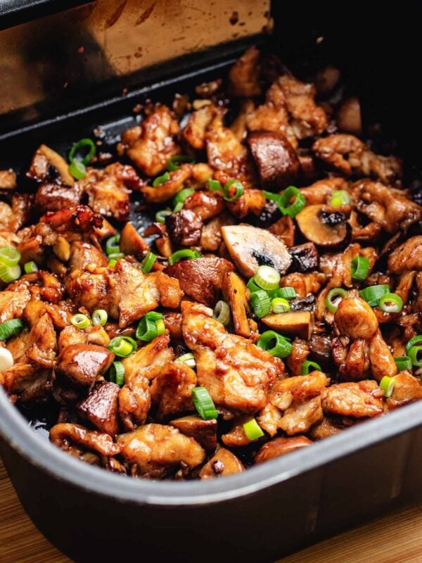 Stir fried chicken made in an air fryer with juicy chicken breast and a dark savory sauce coats the chicken just like a wok stir fried texture and flavor.